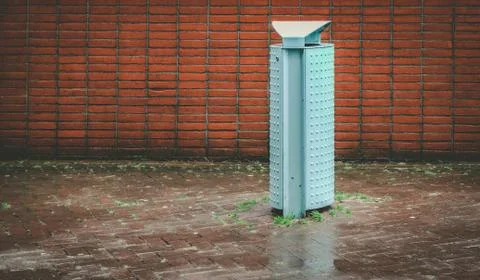 Trashcan on a rainy day Stock Photos