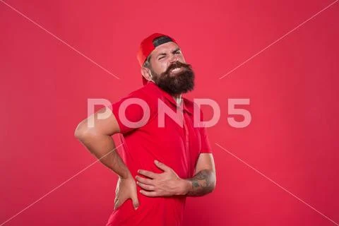 Trauma and treatment. Exercises for back. My back hurts. Man painful face Stock Photos