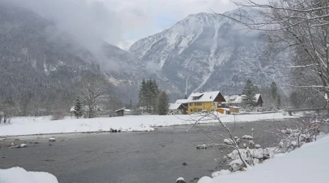 Traun River flowing on a winter day, Hallstatt Stock Footage 61473107