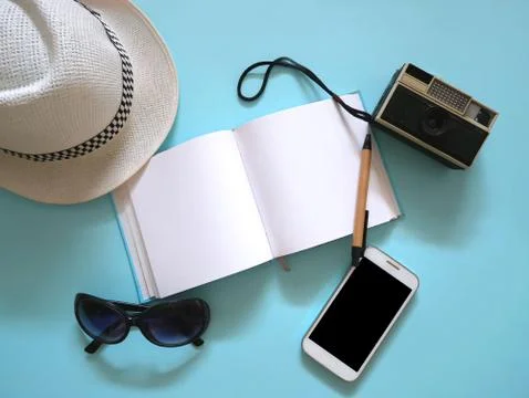 Travel accessories on blue background Stock-Fotos
