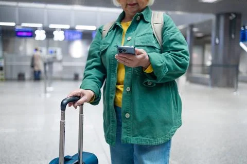 Travel, airport senior 60s woman in comfy casual outfit going vacation alone Stock Photos