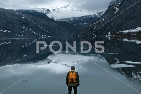 Travel and adventure background, hiker with backpack enjoying landscape in Stock Photos