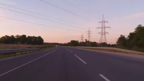 Travel around Europe by car. Shot at In evening sunset in a 2 way road crossi Stock Footage