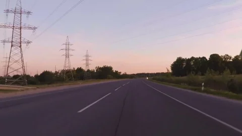 Travel around Europe by car. Shot at In evening sunset in a 2 way road crossi Stock Footage