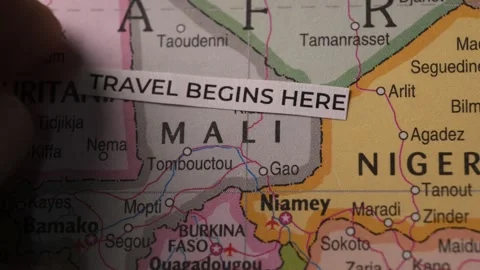 Travel Begins Here Label Placed on Africa Map Close Up Stock Footage 346505354