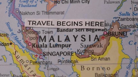 Travel Begins Here Text Label on World Map Focused on Malaysia Stock Footage 346763912