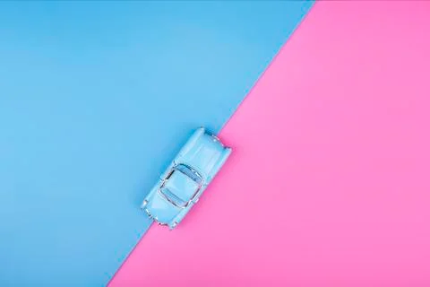 Travel blue car model on pink blue background. Top view Stock Photos