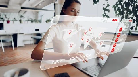 Travel booking process using laptop with world map display showing various Stock Photos