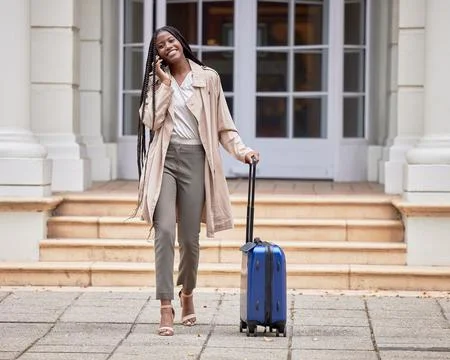 Travel, business phone call and black woman with suitcase in city for conference Stock Photos