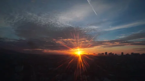 Travel: cityscape view at sunset through glass from moving cabin of ropeway Stock Footage 56642398