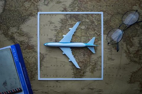 Travel concept. Map on the table andl aircraft. 库存照片