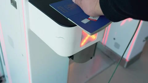 Travel entry process at automated checkpoint in bustling international airport Stock Footage 315596185