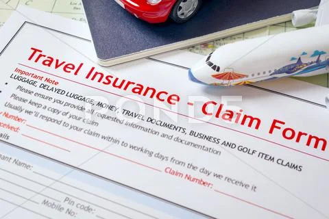 Travel Insurance Claim Application Form On Table, Business And Risk Concept;
