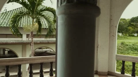 Travel Man with a Backpack on Back Standing on Balcony of Abandoned Building Stock Footage 138523671