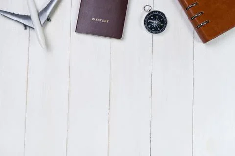Travel objects and document on top of white wooden space Stock Photos
