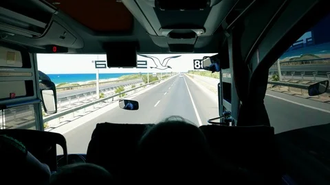 Travel, rest. Holidaymakers people travel by tourist bus along the sea shore Stock Footage