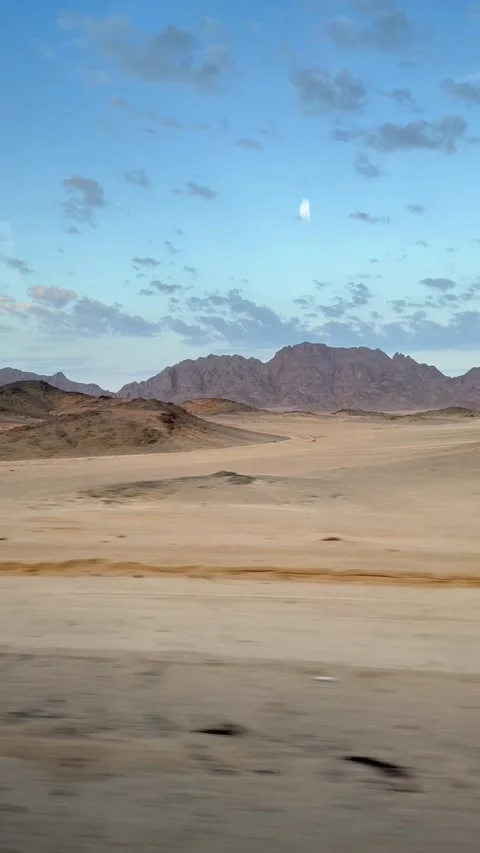 Travel Scene Featuring Motion Blurred Vehicle View Over Vast Rocky Desert Stock Footage 324807426