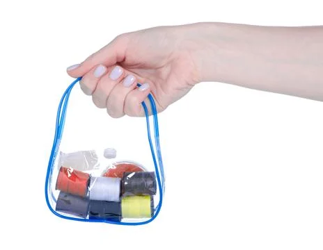 Travel set of threads and needles in hand Stock Photos