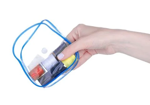 Travel set of threads and needles in hand Stock Photos