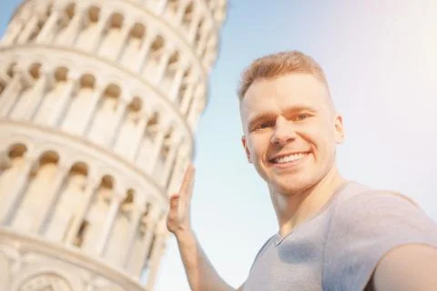 Travel tourists Man making selfie in front of leaning tower Pisa, Italy Stock Photos