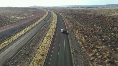 Travel trailer down open highway. Drone shot. Video stock 169545950