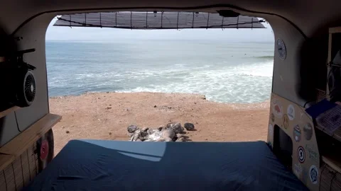 Travel van with back door open to ocean view in the morning, Inside shot Stock Footage 241302135