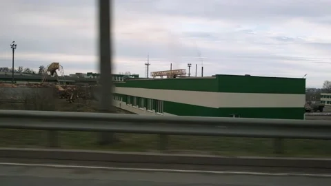 Travel view from a car window at an enterprise, industrial plant Stock Footage 237240359