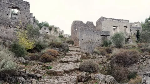 Traveler with Backpack Exploring the Abandoned Ruins of Kayaköy Ghost Village, F 스톡 동영상 294092631