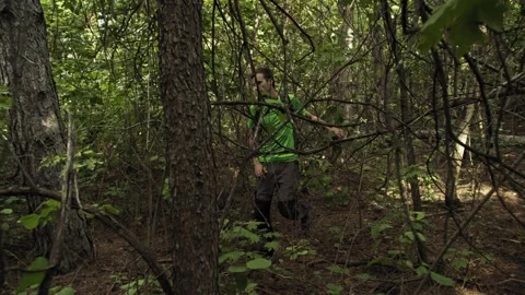 Traveler With A Backpack Walks Through The Forest. Survivalist Stock Footage 161484718