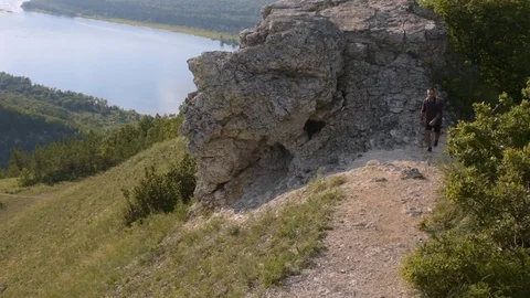 Traveler coming down the mountain Stock Footage 72587663