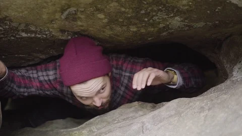 Traveler Crawling Through The Cave in Deep Forest, Slow Motion Stock Footage 108610573