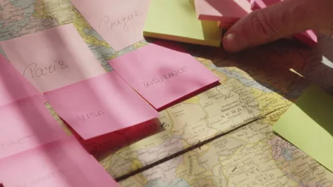 Traveler Creates Colorful Reminder Notes While Planning Future Holiday Stock Footage 337761763