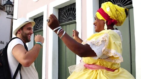 Traveler dancing with Brazilian Woman - Baiana, Brazil Stock Footage