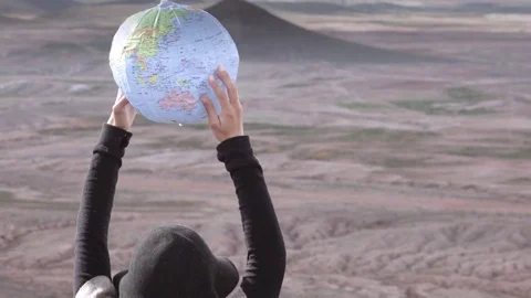 Traveler holding the world Stock Footage 80746465