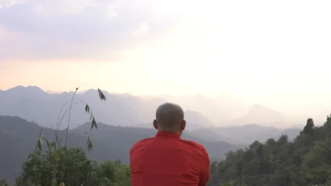 Traveler looking at mountain range view with sunset hazy sky cinemagraph Stock Footage 87762713