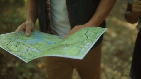 Traveler map in the hands of backpacker in the forest Stock Footage 96185331