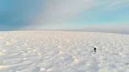 Traveler In Mountains Aerial Landscape. Epic Drone Video Of Man Walking Snow Stock Footage