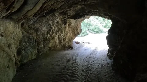 The traveler passes through a small cave on through. Poland Stock Footage 253628242