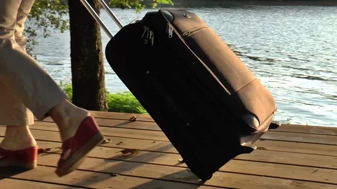 Traveler with suitcase going from right to left Stock Footage 90043960