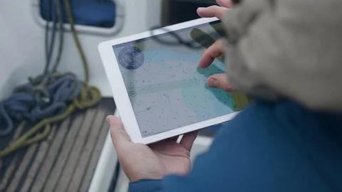 Traveler using digital tablet looking map while sailing on sea ship Stock Footage 93283143