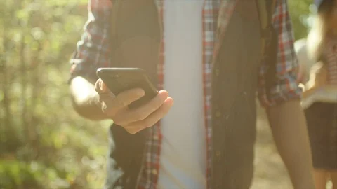 Traveler using mobile phone navigation on hiking in the forest Stock Footage 96185175