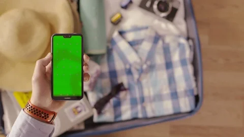 A traveler is using a smartphone Stock Footage 102707139