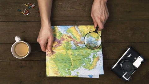 Traveler with world map Stock Footage 71167516