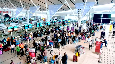 Travelers in check-in queue at Cape Town International airport Stock Footage 315159608