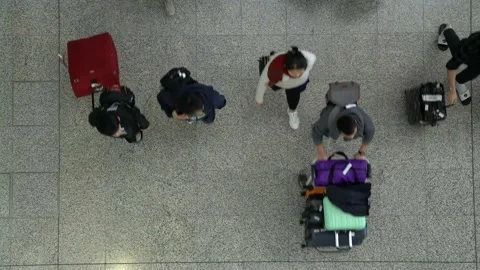 Travelers at Hong Kong Airport (bird's eye view) Stock Footage