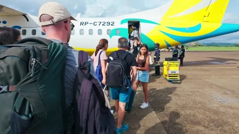 Travelers Queue To Board Plane Cebu Pacific, Coron Palawan Philippines Video stock 334095834