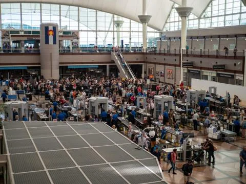 Travelers standing in long queue at TSA security checkpoint at Denver Stock Photos