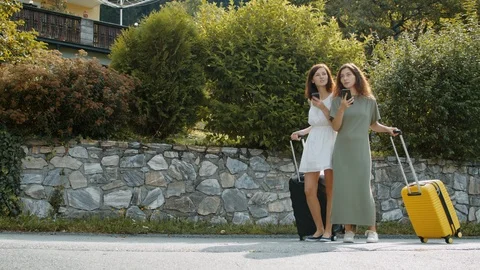 Travelers with suitcases using the maps app Stock Footage 120108249