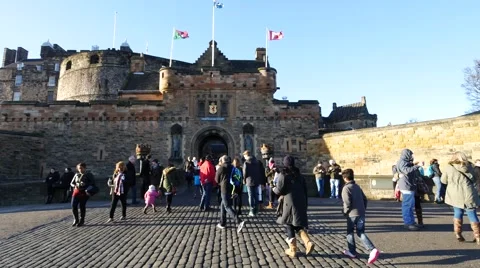 Travelers walking in front of Edinburgh Castle, Scotland on Sunny Day Stock Footage 59742010