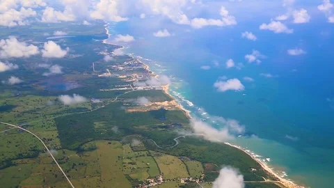 Traveling by air above clouds. View through an airplane window. Flying over the Stock Footage 80988842